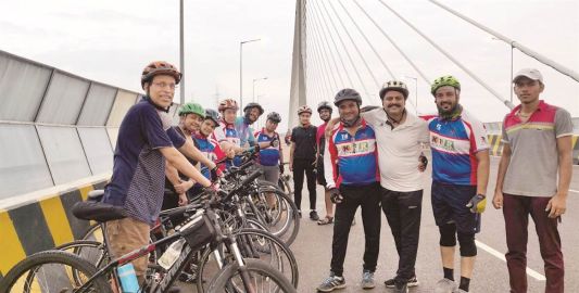 The cycling team: Dr Suresh K. Pandey, Dr B.S. Shekhawat, Dr Ashok Moondra, and other cyclists while cycling on the Hanging Bridge of Kota city.